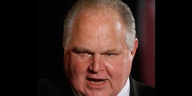 Jan. 13, 2009: In this file photo, conservative talk show host Rush Limbaugh talks with guests in the East Room of the White House in Washington.
