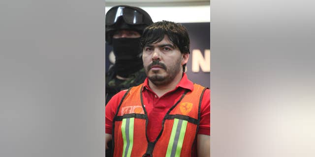 FILE - In this May 13, 2011 file photo, Martin Beltran Coronel, alias “El Aguila,” is presented to the media in Mexico City. A Mexican Federal Judiciary Council said late Wednesday, Sept. 24, 2014, the court has ordered the release of Beltran Coronel, the nephew of deceased Sinaloa drug cartel leader Ignacio Coronel, because of procedural violations, an embarrassment for officials who had portrayed the man as his uncle’s likely successor. Beltran Coronel had been charged with organized crime and the other four faced money laundering charges. (AP Photo/Alexandre Meneghini, File)