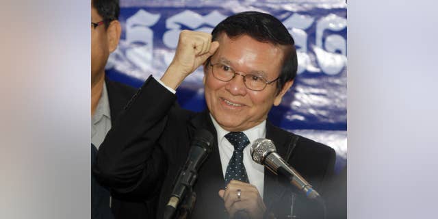 FILE - In this Sept. 9, 2016 file photo, Kem Sokha, deputy leader of the Cambodia National Rescue Party, gestures as he speaks at the party's headquarters in Phnom Penh, Cambodia. Executive members of Cambodia's beleaguered opposition party have accepted the resignation of Sam Rainsy, its charismatic leader, and named his deputy, Kem Sokha, acting chief until a party congress can be held. (AP Photo/Heng Sinith, File)