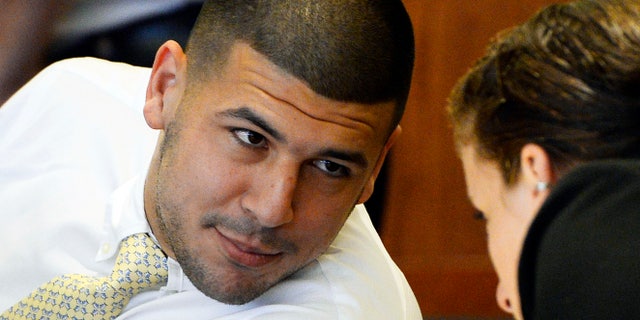 FILE - In this Oct. 2, 2014 file photo, former New England Patriots NFL football player Aaron Hernandez attends an evidentiary hearing at Bristol County Superior Court in Fall River, Mass. Hernandez has pleaded not guilty to first-degree murder in the 2013 shooting death of Odin Lloyd, a Boston semi-professional football player who was dating the sister of Hernandez's fiancee. Hernandez is due back in Bristol Superior Court for a pre-trial hearing Friday, Dec. 12, 2104, less than a month before jury selection in the trial is scheduled to begin. (AP Photo/CJ Gunther, Pool)
