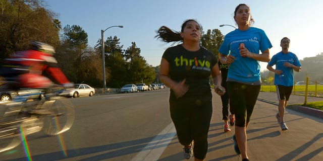 Dec. 11, 2012: In this photo, Zendi Solano, center, trains with running club members Rian Barrett, second from right, and Richard Chen in Pasadena, Calif.