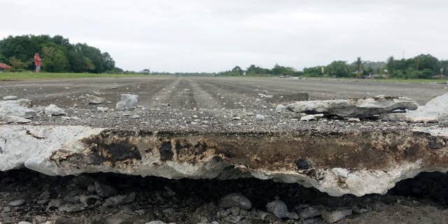 A damaged runway of Surigao City Airport is seen Saturday, Feb. 11, 2017 following a powerful nighttime earthquake that rocked Surigao city, Surigao del Norte province in southern Philippines. The late Friday quake roused residents from sleep in Surigao del Norte province, sending hundreds to flee their homes. (AP Photo)