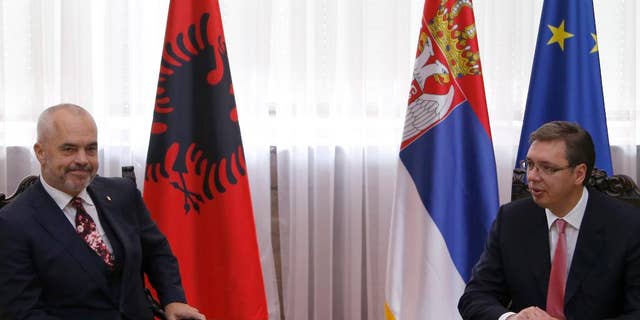 FILE - In this Thursday, Oct. 13, 2016 file photo, Serbian Prime Minister Aleksandar Vucic, right, speaks with his Albanian counterpart Edi Rama in Belgrade, Serbia. Serbian officials warned on Friday, April 21, 2017 of another war in the Balkans if Albanians try to form a joint state with Kosovo in the war-weary European region and the West does not reject such a plan. (AP Photo/Darko Vojinovic, File)