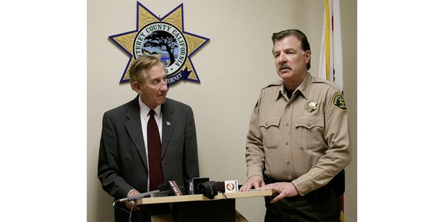 Monterey County District attorney Dean Flippo, left, and Monterey County Sheriff Scott Miller answer questions during a news conference, Tuesday, Feb. 25, 2014, in Salinas, Calif. Flippo said the six officers, including the recently retired police chief and the acting chief, have been arrested, in connection to a scheme to steal more than 200 cars from poor Hispanic people. (AP Photo/The Monterey County Herald, Vern Fisher)