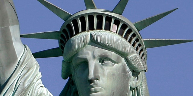 May 20, 2009: The Statue of Liberty against the deep blue sky in New York Harbor. On Friday, Oct. 28, 2011 the statue will host the 125th anniversary of its dedication with a Naturalization Ceremony, the presentation of a gift to continue its preservation and an evening fireworks display.