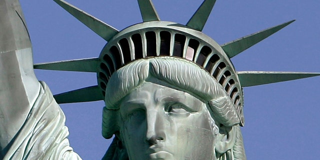 May 20, 2009: The Statue of Liberty against the deep blue sky in New York Harbor. On Friday, Oct. 28, 2011 the statue will host the 125th anniversary of its dedication with a Naturalization Ceremony, the presentation of a gift to continue its preservation and an evening fireworks display.