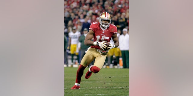 FILE - In this Jan. 12, 2013 file photo, San Francisco 49ers wide receiver Michael Crabtree (15) runs against the Green Bay Packers in an NFC divisional playoff NFL football game in San Francisco. The team's top wide receiver from 2012 is back on the active roster six months after Achilles tendon surgery and poised to make his season debut Sunday against St. Louis if all goes as hoped during practice this week. (AP Photo/Tony Avelar, File)