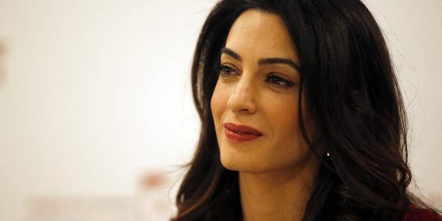 FILE - In this Jan. 25, 2016, file photo, British lawyer Amal Clooney attends a press conference with former Maldives president Mohamed Nasheed in London. Clooney is pushing for the United Nations to investigate and prosecute Islamic State commanders for genocide. Clooney wants IS leaders tried over the killings. The British lawyer appeared on NBC’s “Today” show in an interview broadcast Monday, Sept. 19, 2016, alongside 23-year-old Nadia Murad, a Yazidi woman who escaped after being captured by IS in 2014. (AP Photo/Alastair Grant, File)