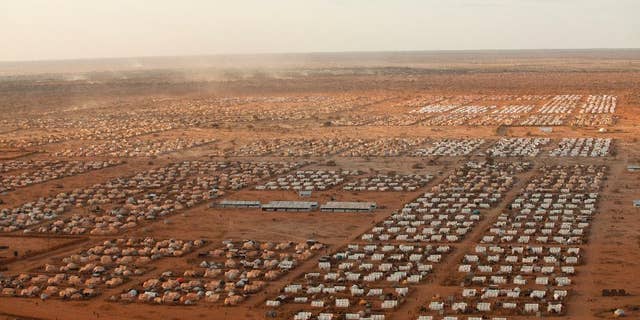 This undated photo provided by MoMA shows IFO 3, an extension to the world's largest refugee camp complex in Dadaab, Kenya. The photograph is part of the exhibit "Insecurities: Tracing Displacement and Shelter," at the museum in New York. The new exhibit invites visitors to take an entirely new look at the concept of home and design, this time through the lens of migration and global refugee emergencies, in which temporary shelters, organizers say, are being deployed on a scale akin to that after World War I. (Brendan Bannon/IOOM/UNHCR/MoMA via AP)