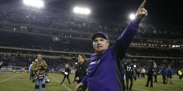 TCU head coach Gary Patterson points to fans as he runs off the field after an NCAA college football game against Kansas State Saturday, Nov. 8, 2014, in Fort Worth, Texas. TCU won 41-20. (AP Photo/LM Otero)