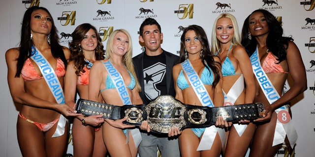 File Photo: Mixed martial artist Dominick Cruz (C) and Tropic Beauty Model Search contestants arrive at a post-fight party for UFC 132 at Studio 54 inside the MGM Grand Hotel/Casino early July 3, 2011 in Las Vegas, Nevada.  (Photo by Ethan Miller/Getty Images for Studio 54)