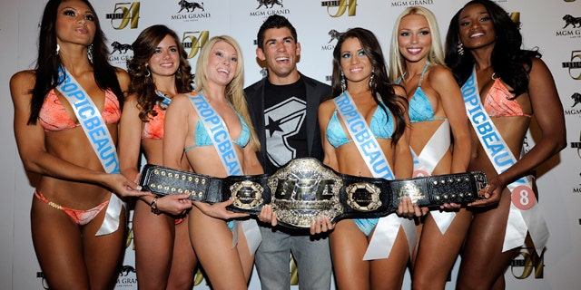 File Photo: Mixed martial artist Dominick Cruz (C) and Tropic Beauty Model Search contestants arrive at a post-fight party for UFC 132 at Studio 54 inside the MGM Grand Hotel/Casino early July 3, 2011 in Las Vegas, Nevada. (Photo by Ethan Miller/Getty Images for Studio 54)