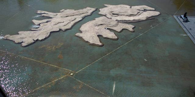 FILE - In this Sept. 18, 2015 file photo, the Malvinas Museum features rocks in the shape of Malvinas, or Falkland Islands, in Buenos Aires, Argentina. Argentina’s government celebrated on Monday, March 28, 2016 a decision by a U.N. commission expanding its maritime territory in the South Atlantic Ocean to include the disputed islands and beyond. The Argentine foreign ministry said the decision will be key in its dispute with Britain over the Islands. Argentina lost the 1982 war with Britain after Argentine troops seized the South Atlantic archipelago. (AP Photo/Natacha Pisarenko, File)