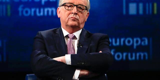 CORRECTS SPELLING OF JUNCKER- The President on the European Commission Jean-Claude Juncker attends a panel discussion about the future of Europe at the Europe Forum event, hosted by the Germany's WDR television and broadcast service, at the Foreign Ministry, in Berlin, Germany, Thursday, May 12, 2016. (AP Photo/Markus Schreiber)