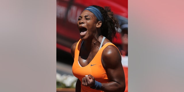 Serena Williams from the U.S. reacts after winning a point during a match against Sara Errani from Italy at the Madrid Open tennis tournament, in Madrid, Saturday, May 11, 2013. (AP Photo/Andres Kudacki)