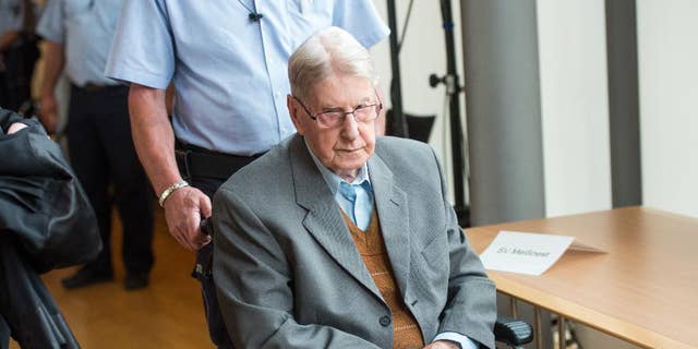 June 11, 2016: A former SS guard at the Auschwitz death camp, Reinhold Hanning, 94, arrives at a courtroom in Detmold, Germany.
