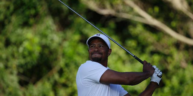 Tiger Woods tees off on the third hole during the third round of the Honda Classic golf tournament, Saturday, March 1, 2014, in Palm Beach Gardens, Fla. (AP Photo/Lynne Sladky)