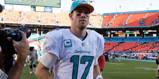 Miami Dolphins quarterback Ryan Tannehill (17) runs off the field after an NFL football game against the San Diego Chargers, Sunday, Nov. 2, 2014, in Miami Gardens, Fla. The Dolphins defeated the Chargers 37-0. (AP Photo/Lynne Sladky)