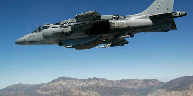 FILE - In this June 21, 2007 file photo, a U.S. Marine Corps AV-8 Harrier fighter jet from VX-9 Naval Air Weapons Station China Lake is seen on a training flight from the cockpit of an F-16 based at the California Air National Guard's 144th Fighter Wing over California. A U.S. Marine Corps AV-8 Harrier fighter jet, the same type shown in this photo, crashed Thursday, Sept. 22, 2016, into the ocean off the coast of southwestern Okinawa in Japan, but the pilot ejected safely from the aircraft and was rescued. The U.S. military in Camp Butler in Okinawa said the cause of the crash is still under investigation. (AP Photo/Ben Margot, File)