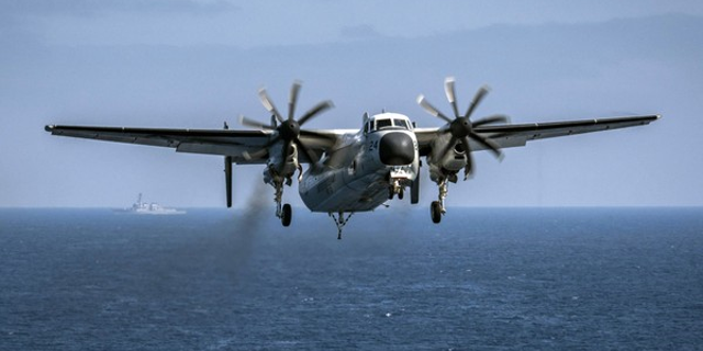 A C-2A Greyhound aircraft prepares to land aboard the aircraft carrier USS Theodore Roosevelt, Aug. 22, 2017.