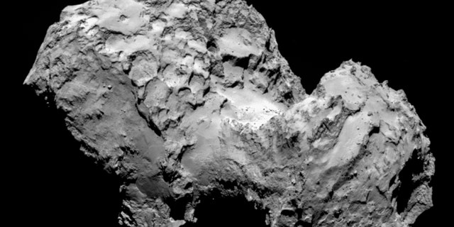 FILE - In this Aug. 3, 2014 file photo taken by Rosetta’s OSIRIS narrow-angle camera Comet 67P/Churyumov-Gerasimenko is pictured from a distance of 285 kms. Scientists at the European Space Agency on Monday, Sept. 15, 2014, announced the spot where they will attempt the first landing on a comet hurtling through space at 55,000 kph (34,000 mph). The maneuver is one of the key moments in the decade-long mission to examine the comet and learn more about the origins and evolution of objects in the universe. (AP Photo/ESA/Rosetta/MPS for OSIRIS Team, File )