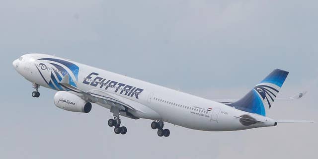 FILE - In this May 19, 2016 file photo, an EgyptAir Airbus A330-300 takes off for Cairo from Charles de Gaulle Airport outside of Paris. Egyptians officials say a bomb threat has forced an EgyptAir airliner en route to Beijing from Cairo to make an emergency landing in Uzbekistan, where the aircraft is being searched. (AP Photo/Christophe Ena, File)