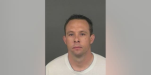This photo provided by the Denver Police Dept. shows deputy Matthew Andrews, a Denver sheriff's deputy arrested after he was accused of helping an escapee who left the county jail wearing a deputy's uniform, the sheriff's department said Monday, April 8, 2013. (AP Photo/Denver Police Dept)