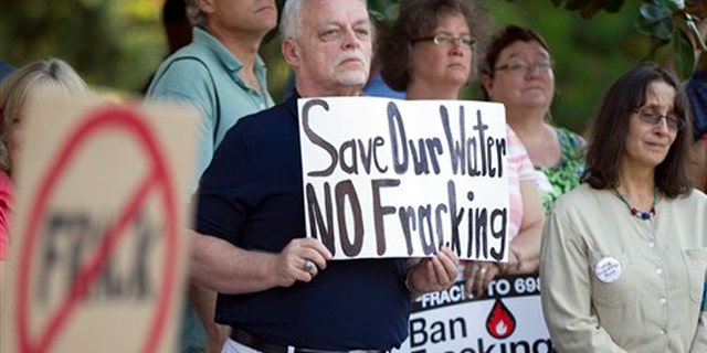 FILE: June 27, 2012: Wake County resident Marvin Woll joins others in Raleigh, N.C., to protest fracking in North Carolina.