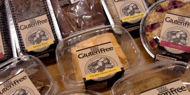 ** FILE ** A sample of some of the 27 gluten-free products are displayed, in this Oct. 5, 2004 file photo, at the Whole Foods Market Gluten-Free Bakehouse in Morrisville, N.C. Each label reads "Produced in a Dedicated Gluten-Free Facility." Once banished to the dusty bottom shelves of obscure grocers, the gluten-free revolution is surfacing in the aisles of major supermarkets. (AP Photo/Karen Tam)