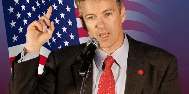 Republican U.S. Senate candidate Rand Paul address supporters at his victory party in Bowling Green, Ky., Tuesday, May 18, 2010. At left is Paul's son William. At right is his wife Kelley and sons Duncan, top, and Robert. (AP Photo/Ed Reinke)