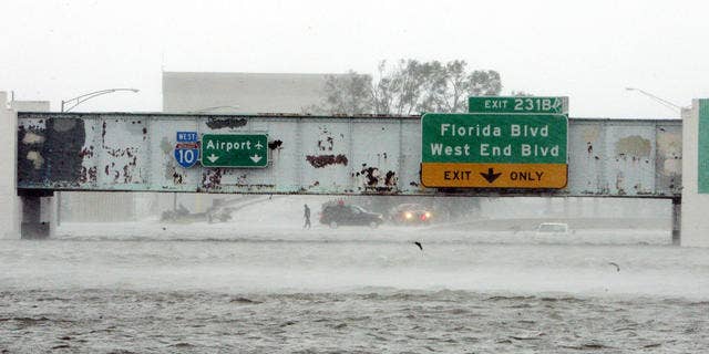The Mound Underpass on Interstate 10 near downtown New Orleans is flooded as Hurricane Katrina batters the city with wind and torrential rain.