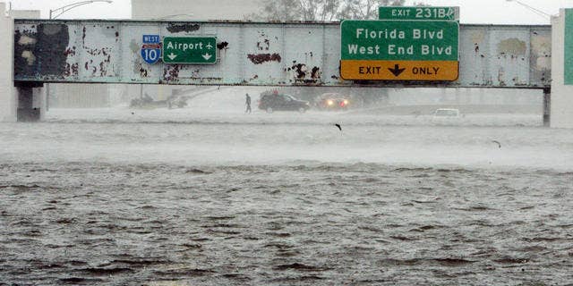 The Mound Underpass on Interstate 10 near downtown New Orleans is flooded as Hurricane Katrina batters the city with wind and torrential rain.