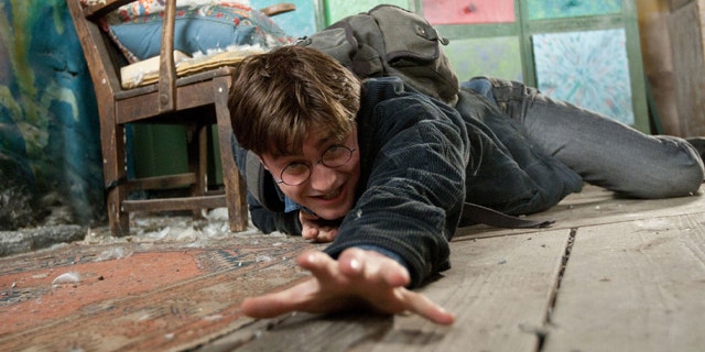 In this film publicity image released by Warner Bros. Pictures, Daniel Radcliffe is shown in a scene from "Harry Porter The Deathly Hallows: Part 1."