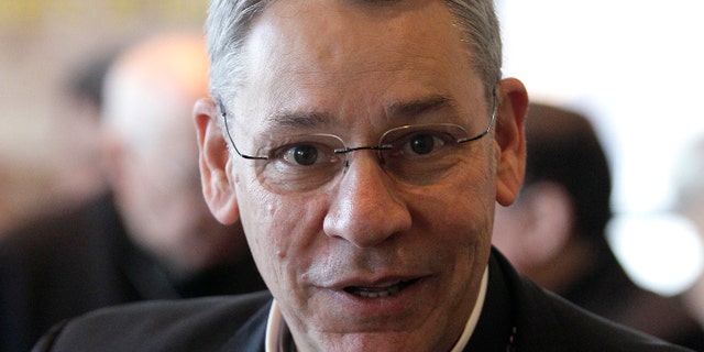 FILE - In this Nov. 14, 2011 file photo, Bishop Robert Finn, of Kansas City, Mo., leaves a meeting at the United States Conference of Catholic Bishops' annual fall assembly in Baltimore. Pope Francis has accepted the resignation of Finn who pleaded guilty to failing to report a suspected priestly child abuser, answering demands of victims to crackdown on bishops who covered up for pedophiles. (AP Photo/Patrick Semansky, File)