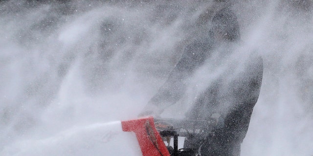 A popular snow blower is being recalled over a safety hazard as heavy winter storms have been blowing across much of the U.S. (AP Photo/Julie Jacobson)
