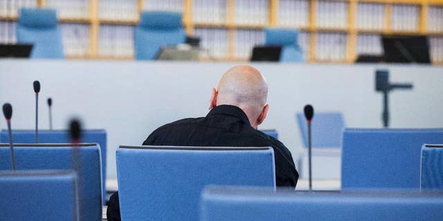 FILE - In this June 22, 2016 file picture accused Frank S. sits in a courtroom of the higher regional court in Duesseldorf, Germany. A German federal court has rejected an appeal Monday Jan. 9, 2017 by a far-right extremist sentenced to 14 years in prison for the attempted murder of a politician who is now Cologne’s mayor. The defendant, identified only as Frank S. in line with German privacy rules, was convicted by a Duesseldorf court in July. Henriette Reker, who was in charge of housing refugees in Cologne at the time, was stabbed in the neck Oct. 17, 2015 as she campaigned. (Rolf Vennenbernd/dpa via AP, file)