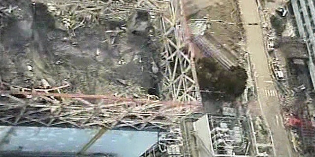 April 10: Image taken by T-Hawk drone aircraft and released by Tokyo Electric Power Co. (TEPCO) shows the damaged reactor building of Unit 1 of the tsunami-crippled Fukushima Dai-ichi nuclear power plant in Okuma, Fukushima Prefecture, northeastern Japan.