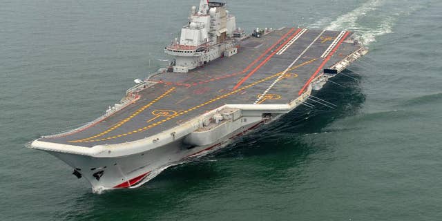 FILE - In this May 2012 file photo provided by China's Xinhua News Agency, Chinese aircraft carrier Liaoning cruises for a test in the sea. On Thursday China's Defense Ministry says the country's first aircraft carrier battle group has carried out its first live-fire exercise. (AP Photo/Xinhua, Li Tang, File)
