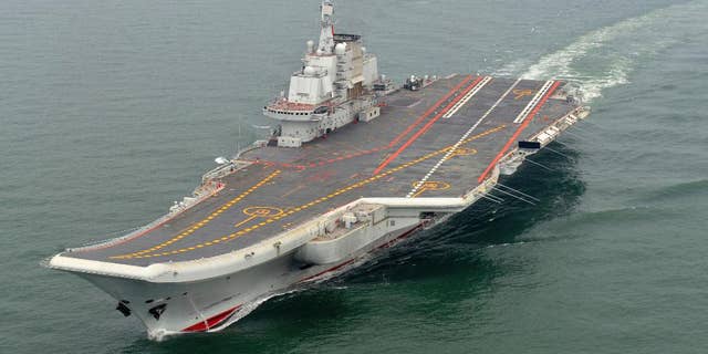 FILE - In this May 2012 file photo provided by China's Xinhua News Agency, Chinese aircraft carrier Liaoning cruises for a test in the sea. On Thursday China's Defense Ministry says the country's first aircraft carrier battle group has carried out its first live-fire exercise. (AP Photo/Xinhua, Li Tang, File)