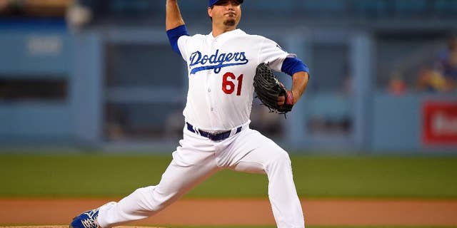 Los Angeles Dodgers starting pitcher Josh Beckett throws to the plate during the first inning of a baseball game against the Detroit Tigers, Wednesday, April 9, 2014, in Los Angeles. (AP Photo/Mark J. Terrill)