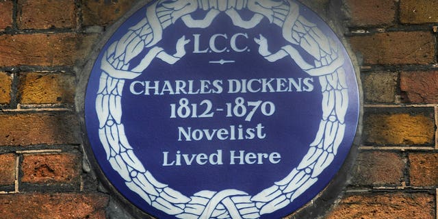 FILE - In this Dec. 5, 2012 file photo, a blue plaque is seen on the exterior of Charles Dickens' home, part of the Charles Dickens Museum in London.