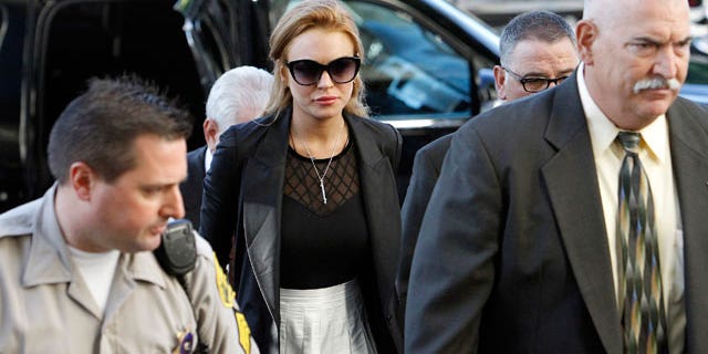 Sept. 24: Lindsay Lohan arrives at a court hearing in Los Angeles after failing a court-mandated drug test. She will now appear in a biopic about John Gotti.