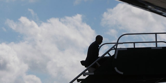 President Barack Obama boards Air Force One in Milwaukee, Monday, Sept. 1, 2014.