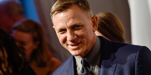 FILE - In this Monday, April 9, 2018, file photo, actor Daniel Craig attends The Opportunity Network's 11th Annual Night of Opportunity Gala at Cipriani Wall Street in New York. After more than a decade at Sony Pictures, James Bond has a few new homes. In a joint announcement with their new partners Thursday, May 24, 2018, Michael G. Wilson and Barbara Broccoli said Universal Pictures will release the 25th installment of the superspy franchise internationally while MGM will release the film in the U.S. Craig will be reprising his role as 007 in the film and Oscar-winner Danny Boyle will direct. (Photo by Evan Agostini/Invision/AP, File)