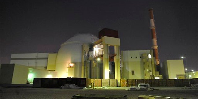 The reactor building of Iran's Bushehr Nuclear Power Plant is silhouetted in this November 2009 photo released by the semi-official Iranian Students News Agency (ISNA).
