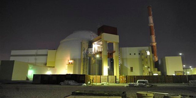 The reactor building of Iran's Bushehr Nuclear Power Plant is silhouetted in this November 2009 photo released by the semi-official Iranian Students News Agency (ISNA).