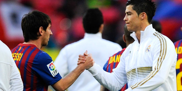 Lionel Messi of FC Barcelona (L) and Cristiano Ronaldo of Real Madrid CF shake hands prior to the La Liga match between FC Barcelona and Real Madrid at Camp Nou on April 21, 2012 in Barcelona, Spain. (Photo by David Ramos/Getty Images)