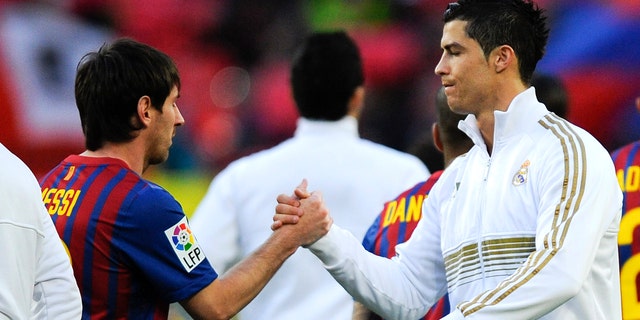 Lionel Messi of FC Barcelona (L) and Cristiano Ronaldo of Real Madrid CF shake hands prior to the La Liga match between FC Barcelona and Real Madrid at Camp Nou on April 21, 2012 in Barcelona, Spain. (Photo by David Ramos/Getty Images)