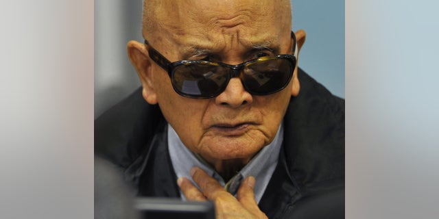 FILE - In this Aug. 29, 2011 file photo released by Extraordinary Chambers in the Courts of Cambodia, Nuon Chea, who was Pol Pot's No. 2 and the group's chief ideologist, sits in the court room of the U.N.-backed war crimes tribunal during a hearing in Phnom Penh. Cambodia's Khmer Rouge tribunal began hearing closing statements Wednesday, Oct. 16, 2013 in its first trial of top leaders of the 1970s communist regime widely considered responsible for the deaths of an estimated 1.7 million people. Nuon Chea and Khieu Samphan, its head of state, are charged with genocide and crimes against humanity — including torture, enslavement and murder — for planning and implementing the group's brutal policies. (AP Photo/Extraordinary Chambers in the Courts of Cambodia, Mark Peters, File) EDITORIAL USE ONLY