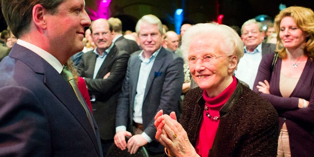 In this photo taken Saturday, Feb. 8, 2014, Els Borst, front right, applauds after a speech from Alexander Pechtold, front left, during a D66 party congress in Amsterdam. Els Borst, a former health minister who drafted the Netherlands' 2002 law permitting euthanasia, has been found dead in her garage on Monday night, police said Tuesday, Feb. 11, 2014. She was 81. Utrecht police spokesman Thomas Aling told state broadcaster NOS that police had not ruled out a natural cause of death, an accident or a crime, but had no reason to suspect a crime. She is survived by three children. (AP Photo/Jiri Buller)